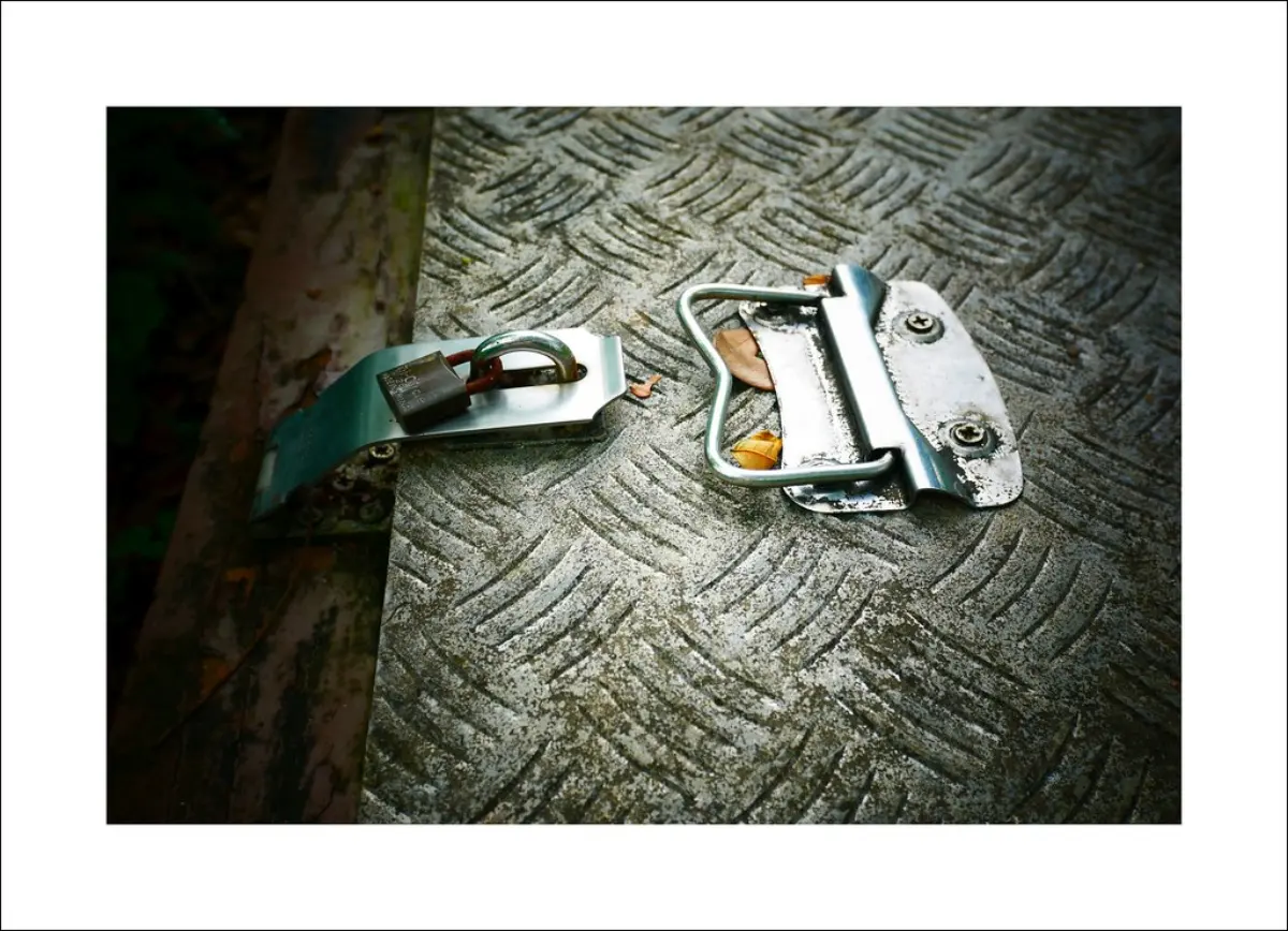 A closed metal padlock